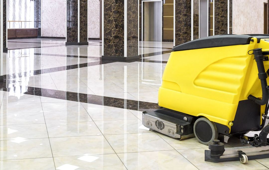 Professional floor scrubbing during a NobleClean SF deep clean